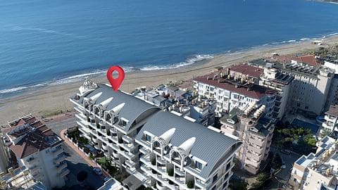 Premier ligne à la mer Appartement à vendre au centre d'Alanya | Revenus locatifs élevés — 1/48