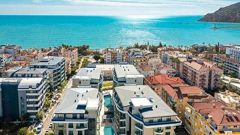 À vendre : appartements à Alanya dans un emplacement central avec piscine et proche de la mer — 1/60