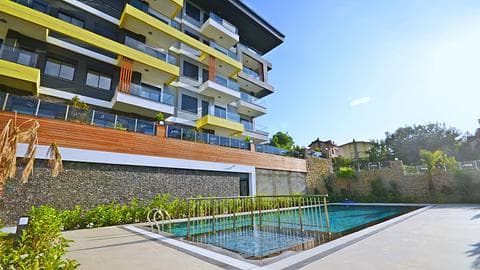 Investir dans des appartements de 1, 2 et 4 chambres avec piscine près de la plage à Kestel, Alanya — 1/31