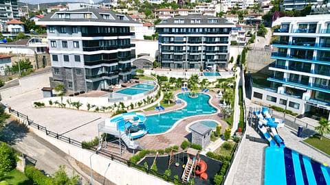 Résidence 1+1 Vue Sur Mer à Vendre à Kargicak Alanya — 1/34